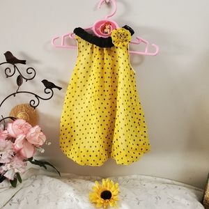 Yellow bodysuit with black polka-dot